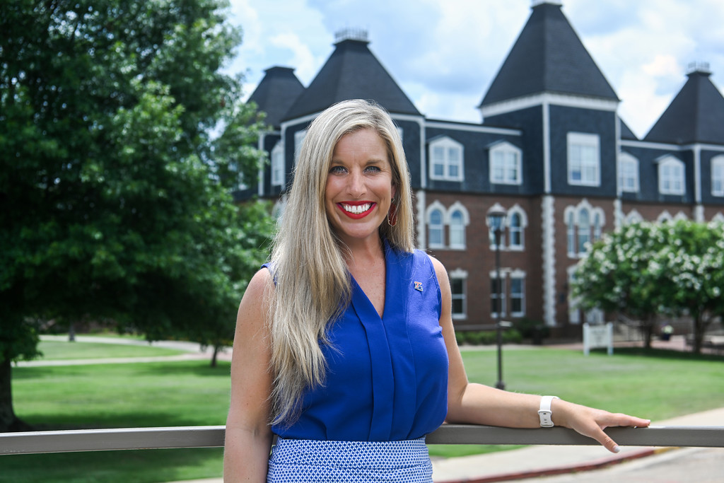Emily Poole Cash in front of Hale Hall