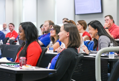 Student bankers in a classroom listening to a lecture