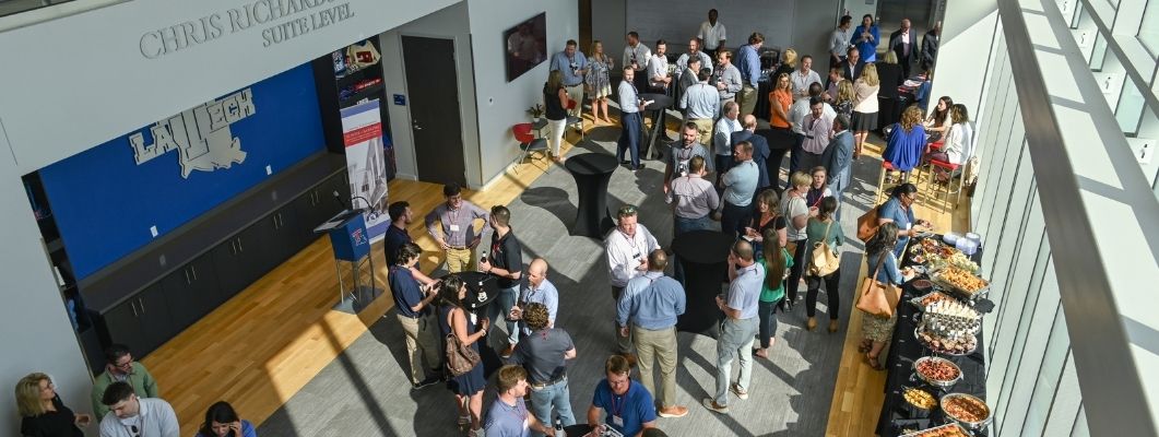 Bankers socializing at the School of Banking reception