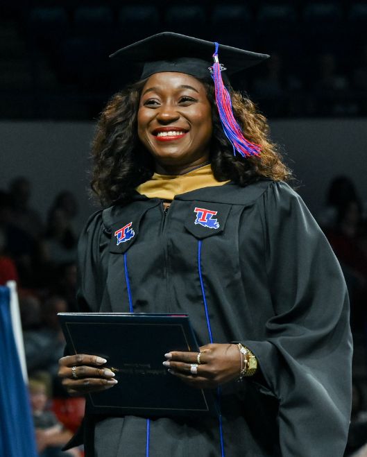 Female graduate student at graduation