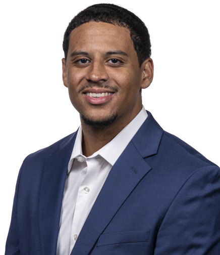 Headshot of Tyson Batiste on a white background