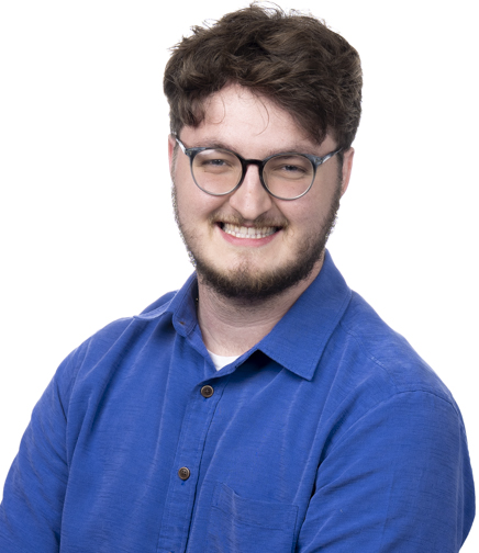 Headshot of Adam Cook on a white background