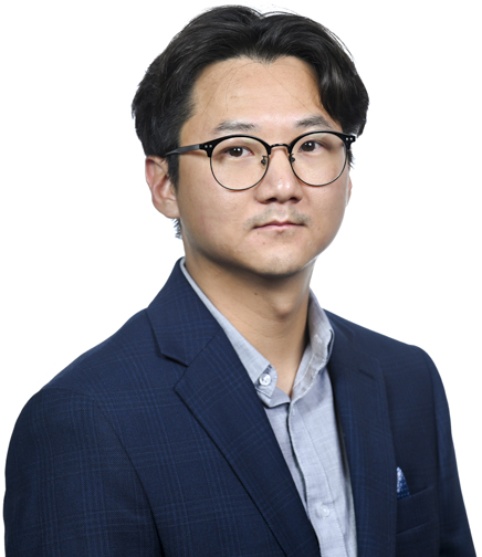 Headshot of Jun Lee on a white background