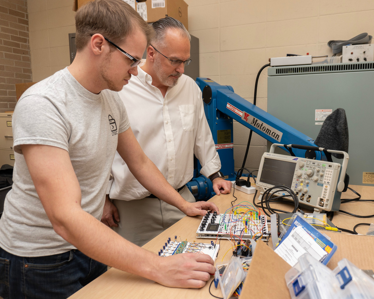 Professor Glisson with student in CYAIL lab