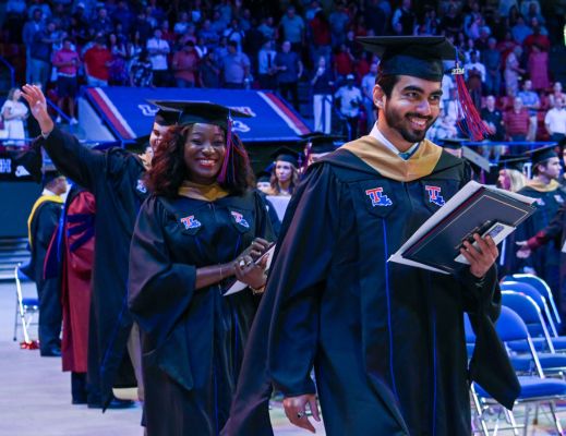 A male and female student at Louisiana Tech's graduation