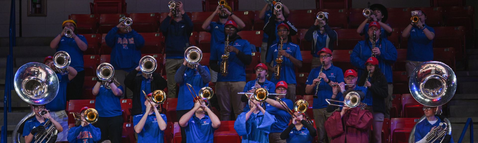 hoop troop band playing in the stands at a basketball game