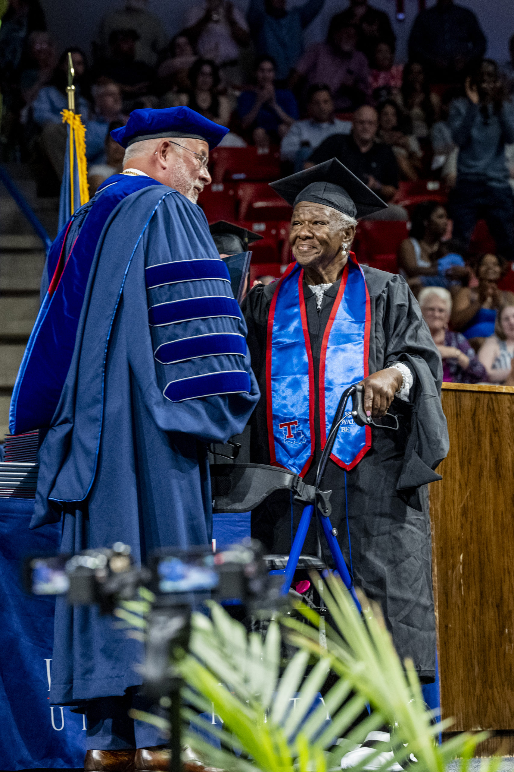President Henderson gives Loretta Wiley her degree