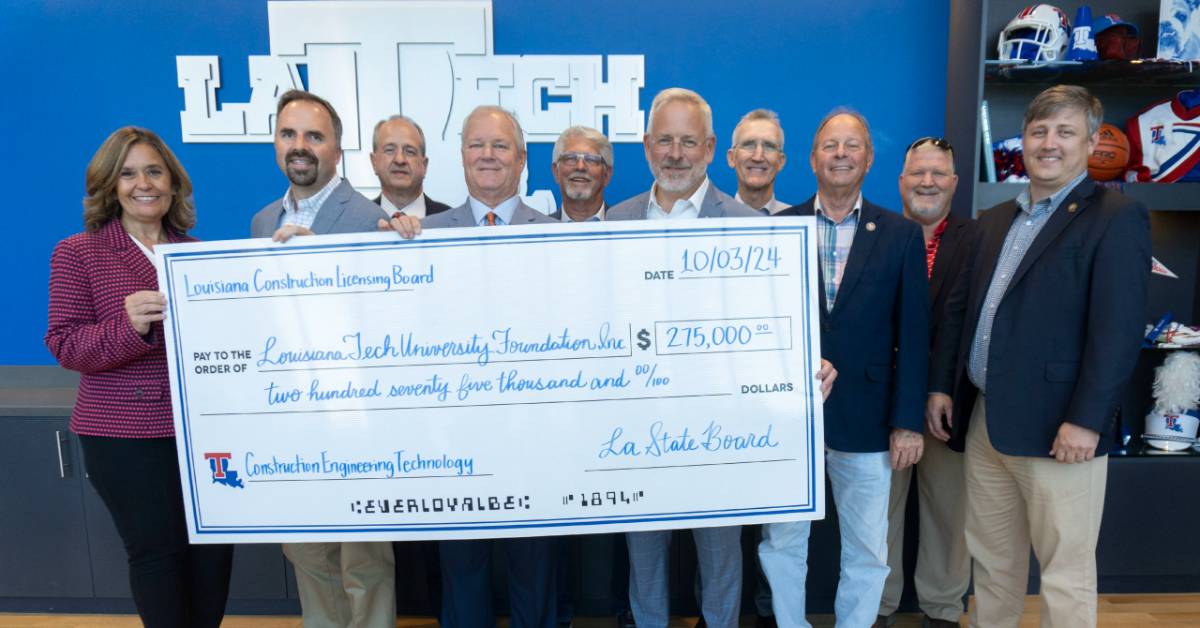 people holding a check