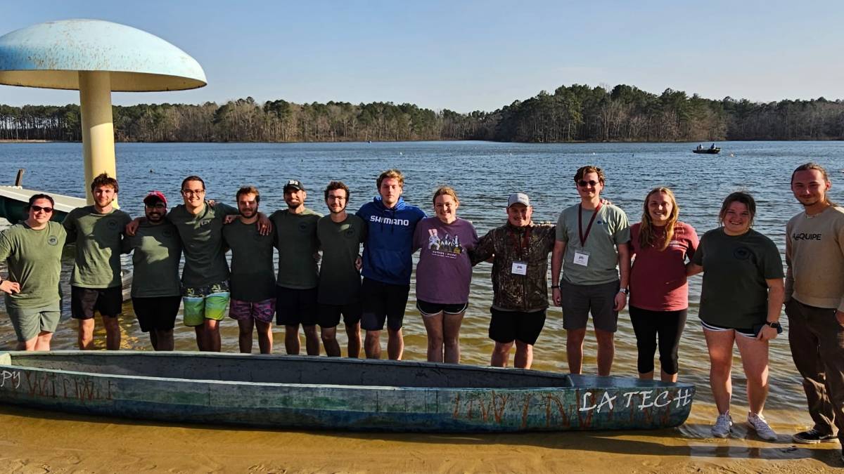 students with a canoe 