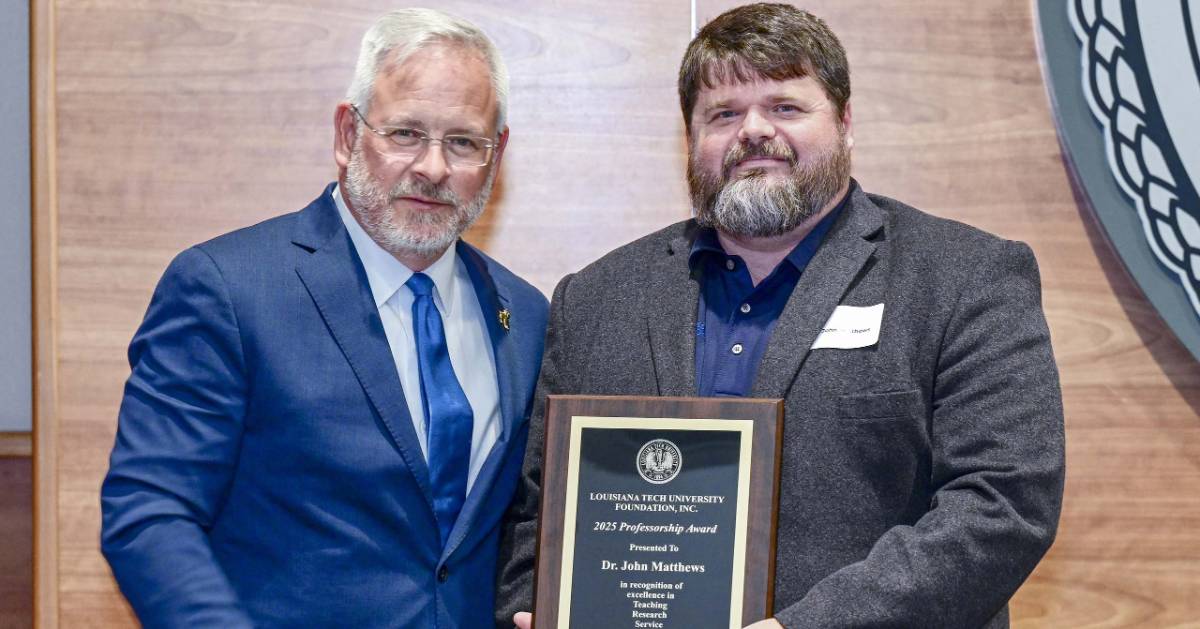 Professor receiving award 