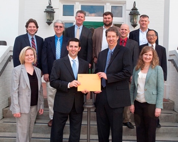 ExxonMobil's Troy Parrington (left) presents check to College of Engineering and Science Interim Dean Dr. Hisham Hegab.