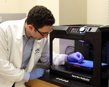 Jeffery Weisman, a doctoral student in Louisiana Tech University’s biomedical engineering program, uses a consumer-grade 3D printer and materials to create custom medical implant ‘beads’ that contain antibiotic and drug delivery properties.