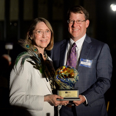 Dr. Susan Roach receives the Louisiana Endowment for the Humanities Award for Lifetime Contribution to the Humanities from Drew Tessier of LEH Board of Directors (Photo credit: Louisiana Endowment for the Humanities.)