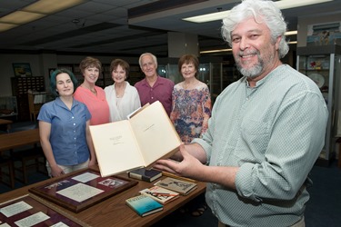 Dr. Don Kaczvinsky, dean of Louisiana Tech’s College of Liberal Arts, holds a signed copy of Ernest Hemingway’s “A Farewell to Arms,” donated as part of the Frellsen Fletcher Smith Collection Gallery at Louisiana Tech.