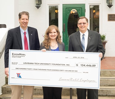 ExxonMobil's Jennifer Johnson (center) presents check to Louisiana Tech President Les Guice (right) and COES Dean Hisham Hegab.