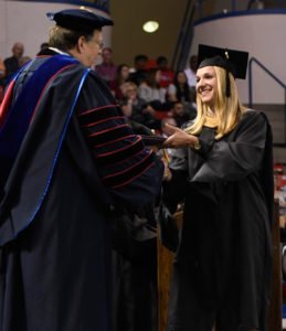 Abbie King of Ruston receives her diploma from Dr. Guice.