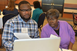 Teachers engage with technology to benefit their classes during a College of Education workshop.