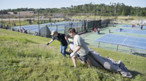 Students move debris during the Big Event.