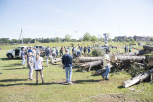 Students move debris during the Big Event.