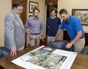 Dr. Les Guice, Conner Killian, Bradley Brown and Dr. Josh Adams discuss the mapping of damaged trees after the April 25 tornado.