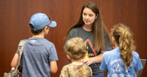 Tech student explains her work at NASA during the RockOn camp.