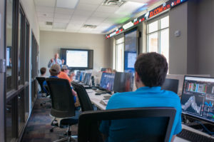 Students engage in world-class education through applied and experiential learning in Ray's Trading Room.