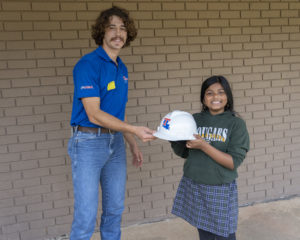 AGC President Jeb Kraft giving the hardhat award to Maryan Wasiuddin