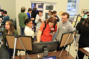 Students interact with product teams at the TOP DOG pitch competition.