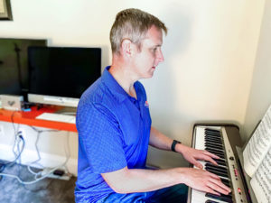 Michael Austin playing piano.