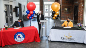 Under the watchful eye of Tech Provost Dr. Terry McConathy, Dr. Les Guice and GSU President Rick Gallot sign an MOU.