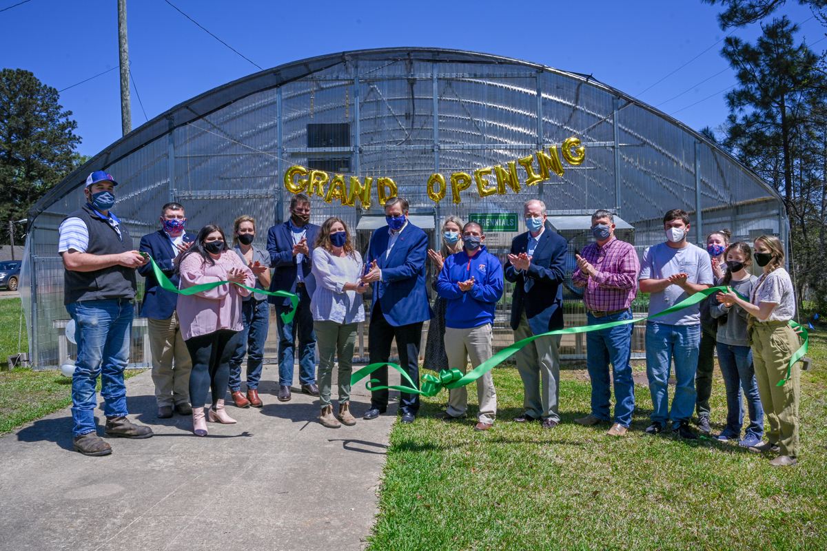 The ribbon is cut to open the renovated Louisiana Tech greenhouse.