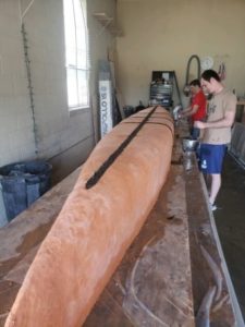 Students make a concrete canoe.