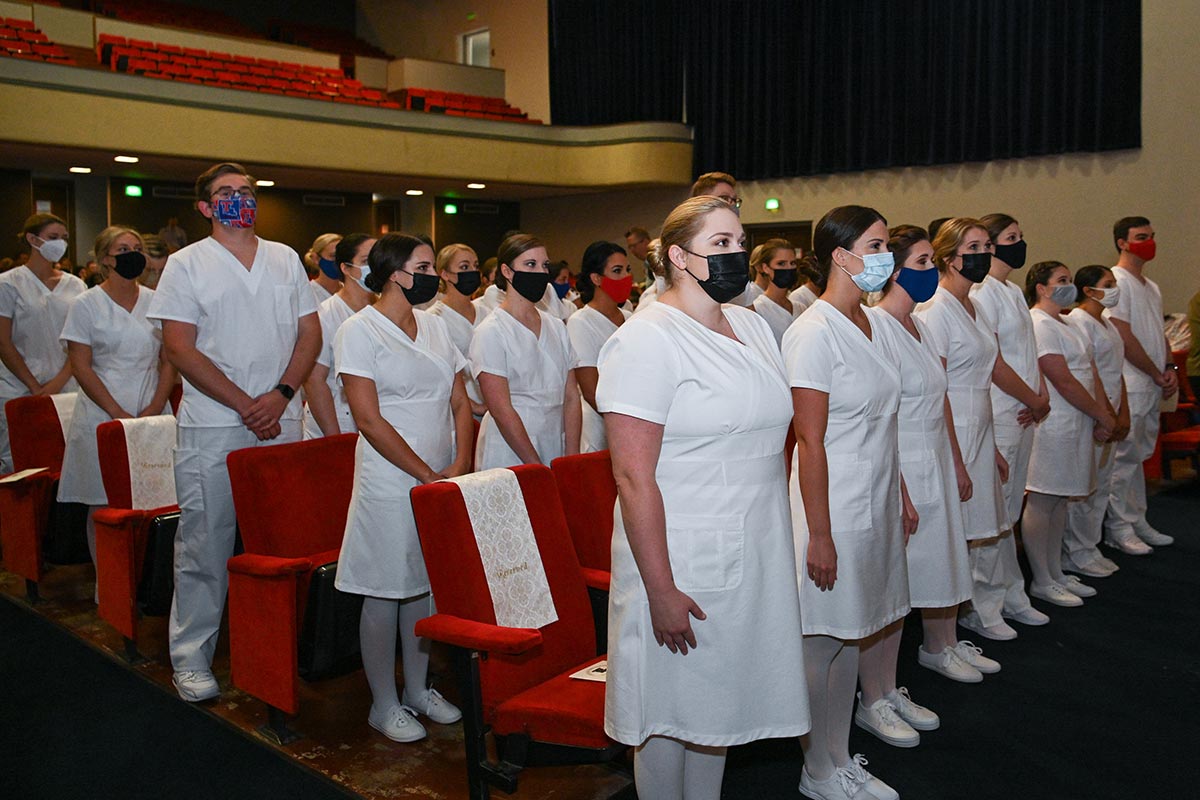 Student nurses await the pinning ceremony.