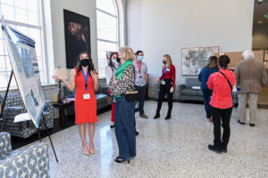 Students present posters about their research to judges.