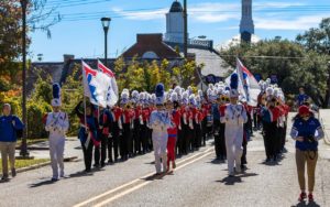 The Band of Pride marches in a parade