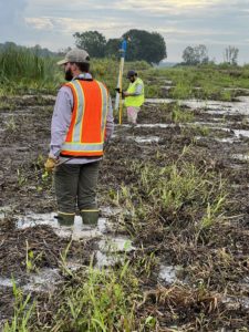 John and HGA surveyor Stacey Coates locate pipelines so gas companies can move them and the state can build a canal to mitigate flooding