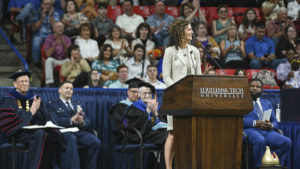 Julia Lelou speaks at the graduation.